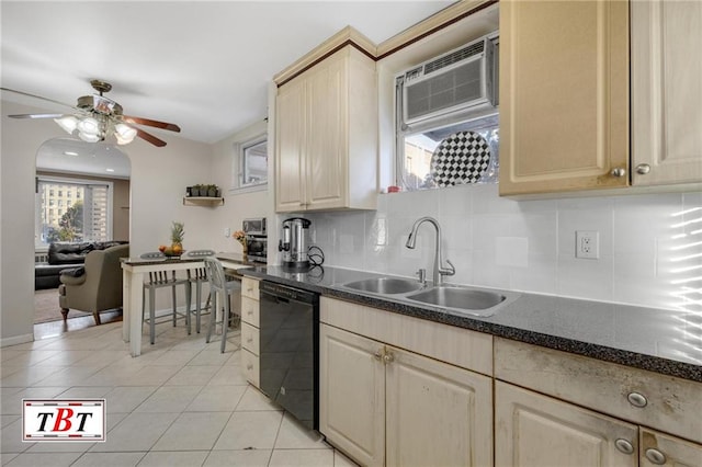 kitchen featuring light tile patterned floors, a ceiling fan, a sink, black dishwasher, and backsplash