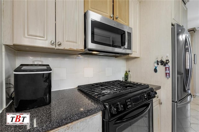 kitchen featuring light tile patterned flooring, tasteful backsplash, light brown cabinetry, and appliances with stainless steel finishes