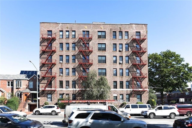 view of property with uncovered parking