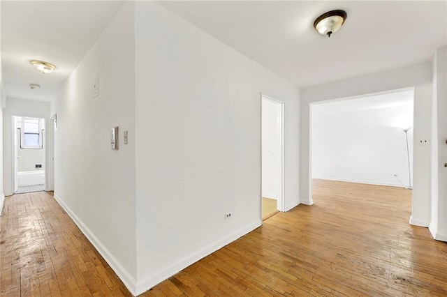 corridor featuring light hardwood / wood-style floors