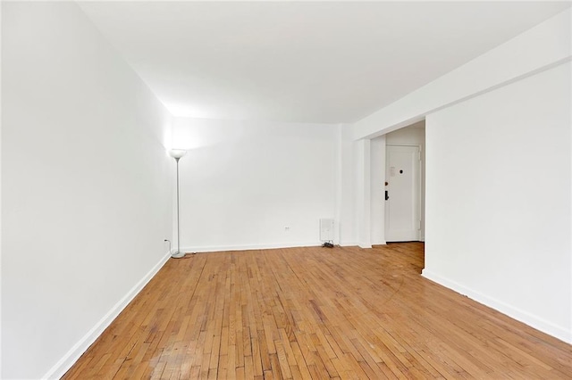 spare room with light wood-type flooring