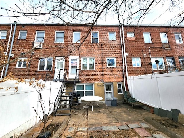 rear view of property featuring a patio