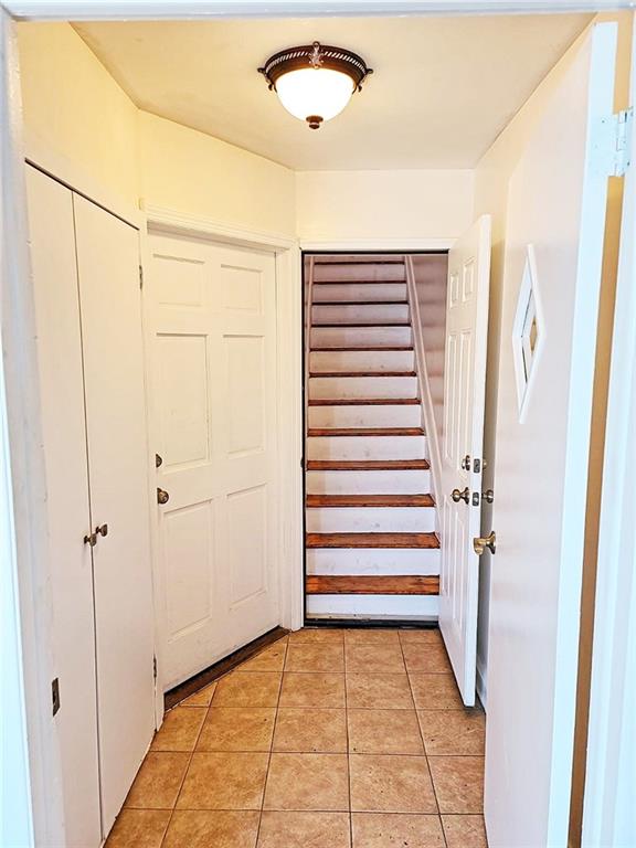 entrance foyer with light tile patterned floors