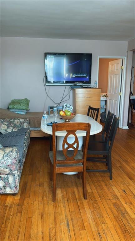 dining area with hardwood / wood-style floors