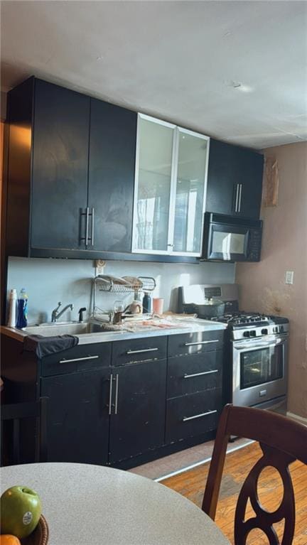 kitchen with light hardwood / wood-style flooring and gas stove