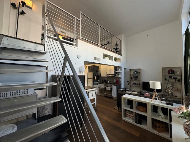 stairs featuring hardwood / wood-style floors