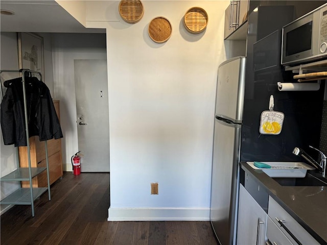 kitchen with dark hardwood / wood-style flooring and sink