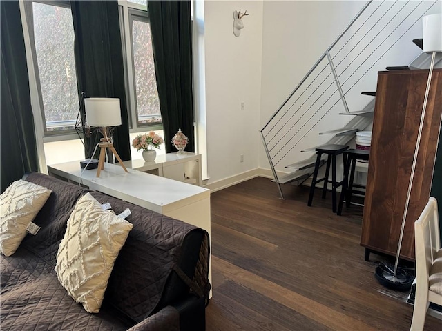 home office with dark hardwood / wood-style flooring