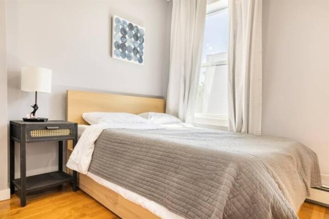 bedroom featuring wood-type flooring