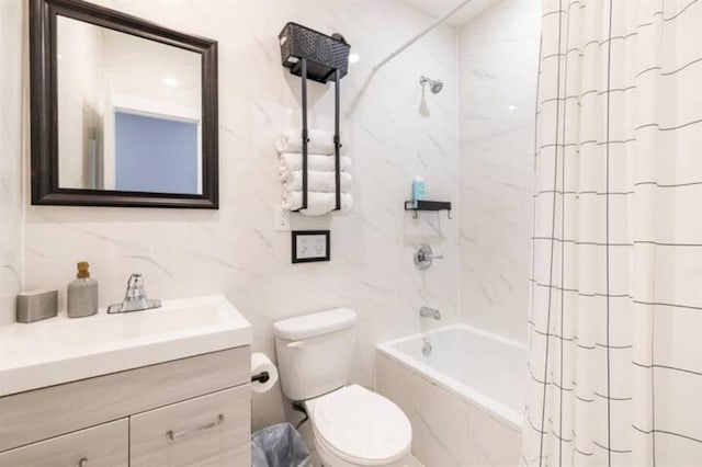 full bathroom featuring shower / tub combo with curtain, vanity, toilet, and tile walls