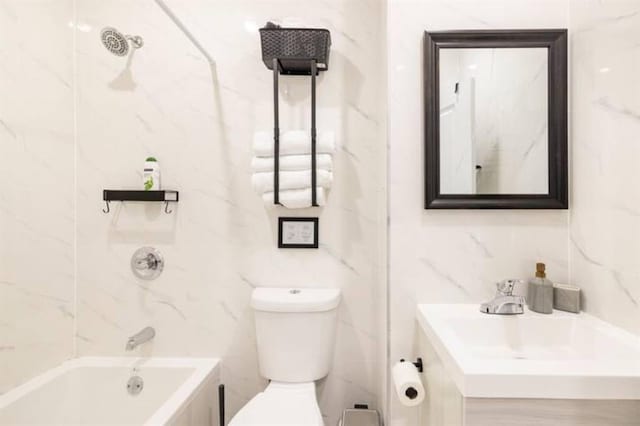 full bathroom featuring vanity, shower / bathing tub combination, tile walls, and toilet