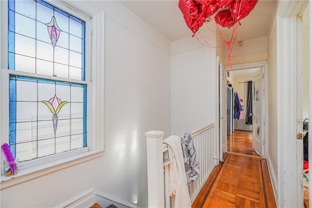 hall featuring parquet floors