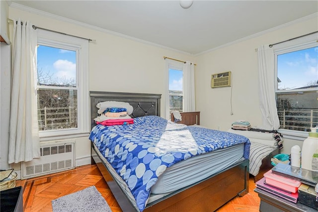 bedroom featuring crown molding, parquet flooring, radiator heating unit, and an AC wall unit