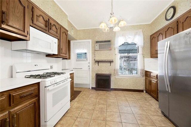 552 17th St, Brooklyn, NY 11215 - kitchen featuring white appliances, wallpapered walls, ornamental molding, a chandelier, and light countertops