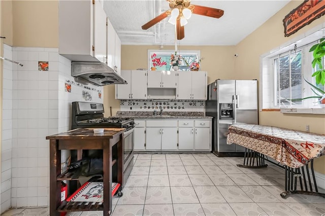 515 E 24th St, Brooklyn, NY 11210 - kitchen with stainless steel appliances, a sink, exhaust hood, a ceiling fan, and plenty of natural light