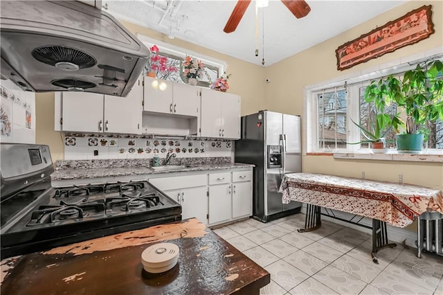 515 E 24th St, Brooklyn, NY 11210 - kitchen featuring stainless steel refrigerator with ice dispenser, extractor fan, a sink, range with gas stovetop, and decorative backsplash