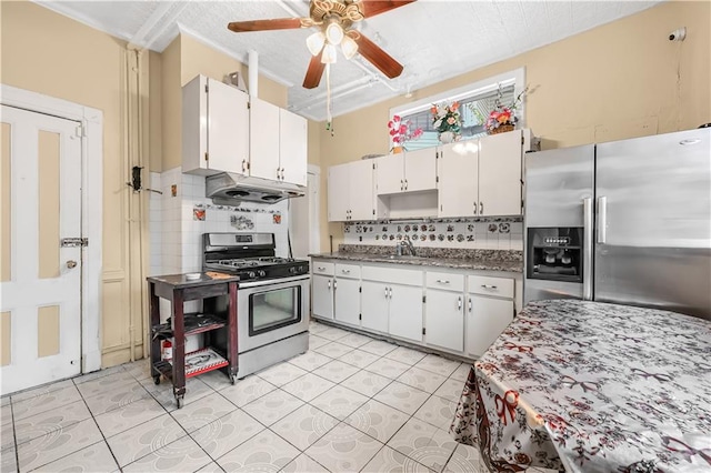 515 E 24th St, Brooklyn, NY 11210 - kitchen with stainless steel appliances, under cabinet range hood, a ceiling fan, backsplash, and light tile patterned floors