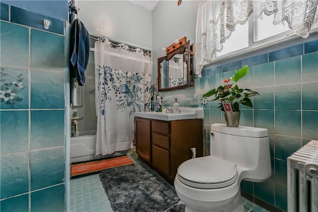 515 E 24th St, Brooklyn, NY 11210 - full bath with radiator heating unit, vanity, shower / bath combo, toilet, and tile patterned flooring