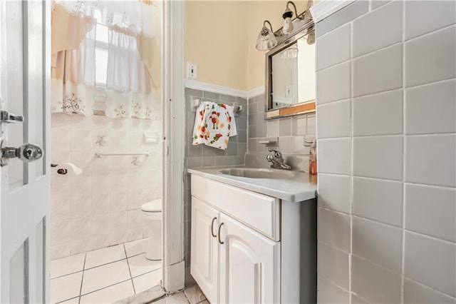 515 E 24th St, Brooklyn, NY 11210 - bathroom featuring tile walls, tile patterned flooring, vanity, and toilet