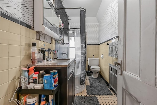 515 E 24th St, Brooklyn, NY 11210 - full bathroom featuring tile walls, toilet, vanity, and a shower with curtain
