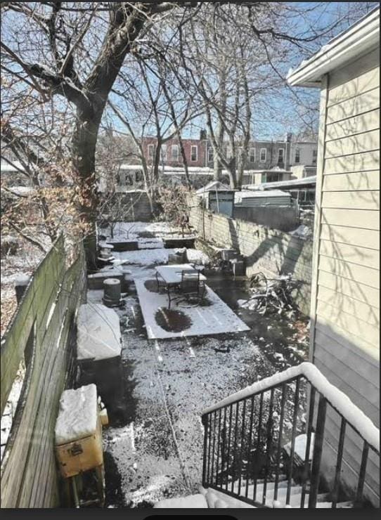 view of yard layered in snow