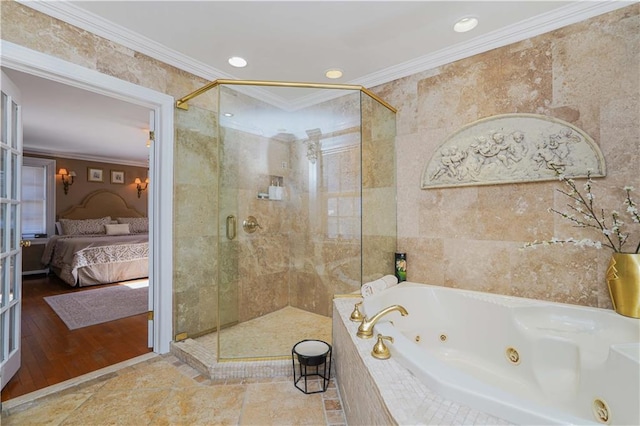 bathroom with ensuite bath, a stall shower, a whirlpool tub, ornamental molding, and tile walls