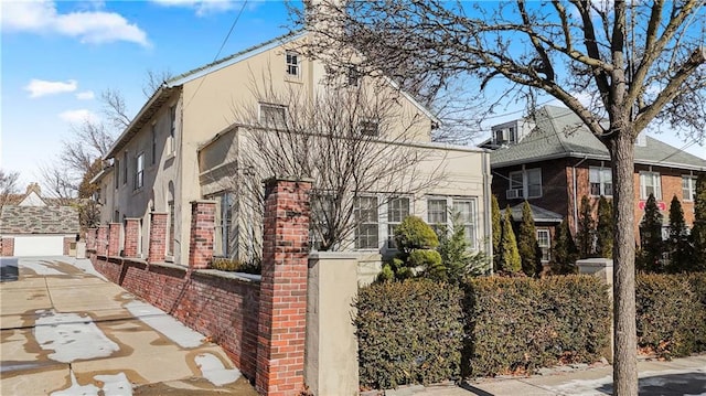 view of side of property with brick siding and stucco siding