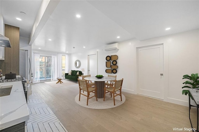 dining space featuring a wall unit AC, light wood-type flooring, recessed lighting, and baseboards