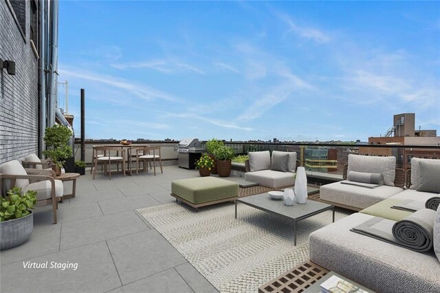 view of patio with outdoor lounge area and grilling area