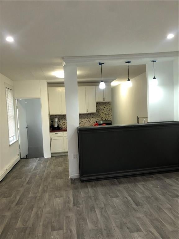 kitchen with tasteful backsplash, hanging light fixtures, recessed lighting, dark wood-style floors, and white cabinets