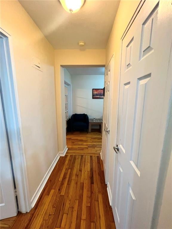 hall with dark hardwood / wood-style floors