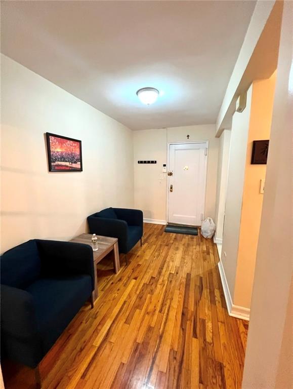 interior space with light wood-style flooring and baseboards