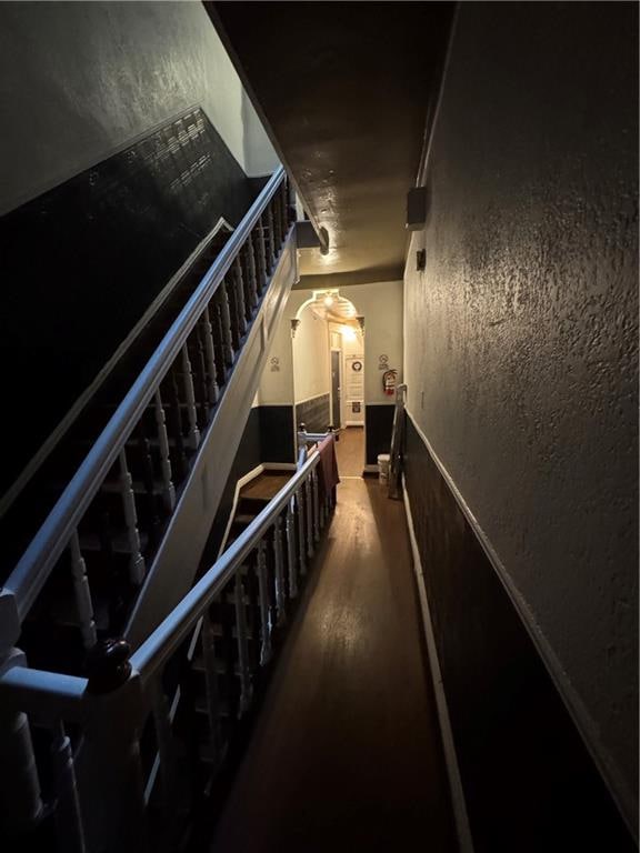 staircase featuring hardwood / wood-style flooring