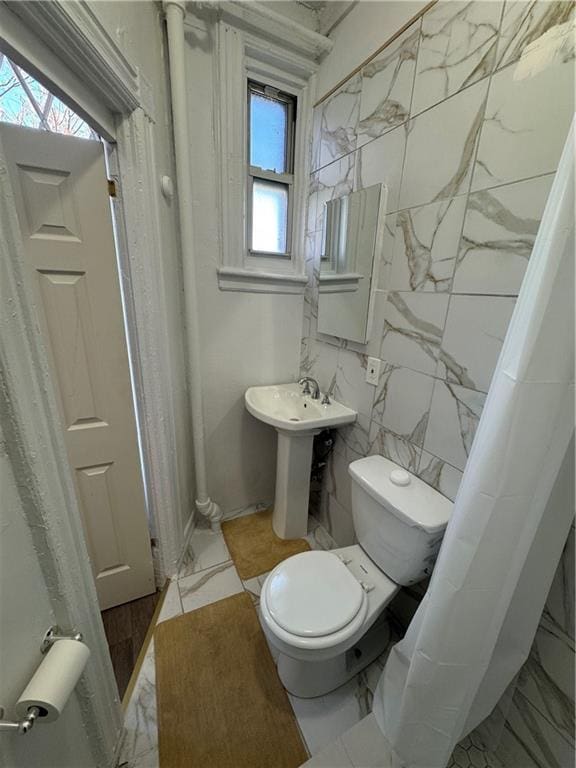 bathroom featuring sink and toilet