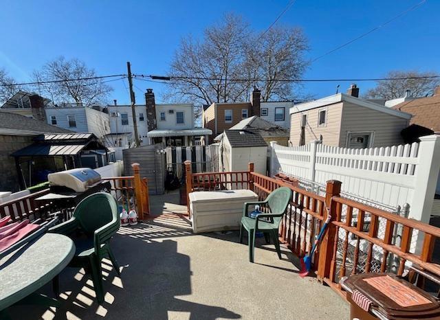 view of patio with a storage shed