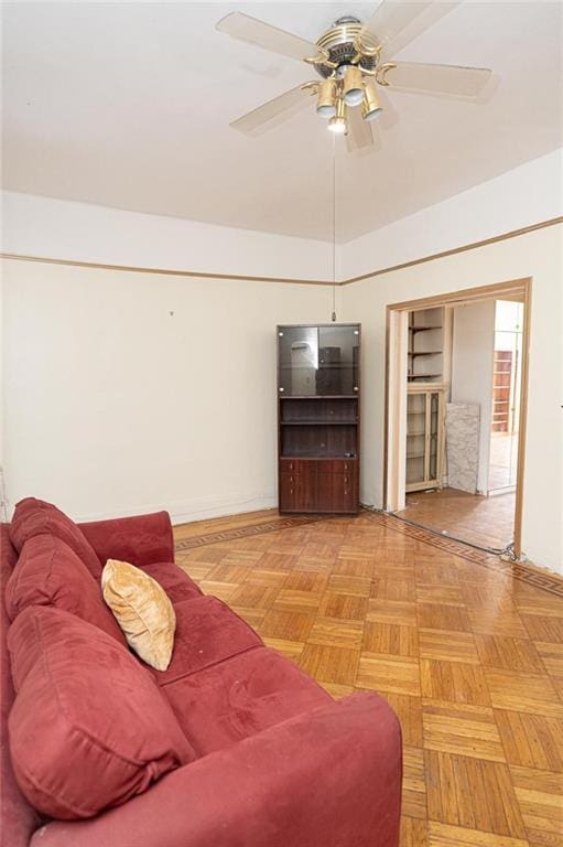 living room featuring light parquet floors and ceiling fan