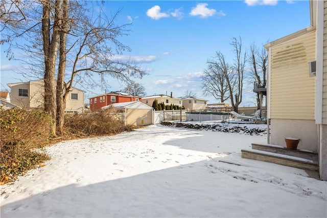 view of yard layered in snow