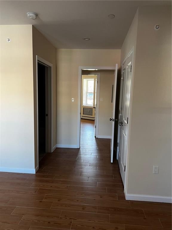 hallway featuring dark hardwood / wood-style floors