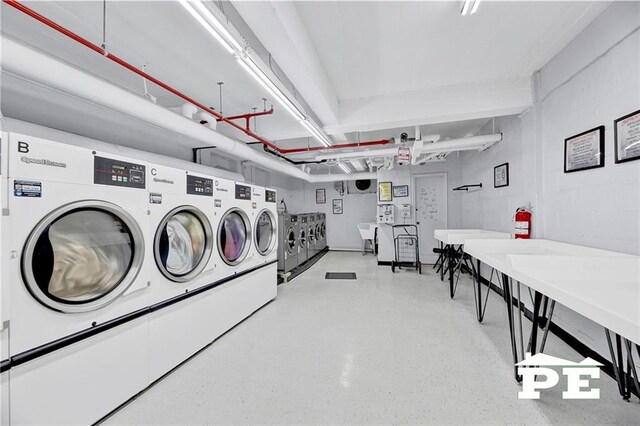 laundry room featuring sink and washer and dryer