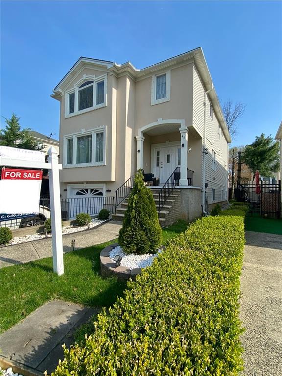 43 Lerer Ln, Staten Island, NY 10307 - view of front of house featuring stucco siding