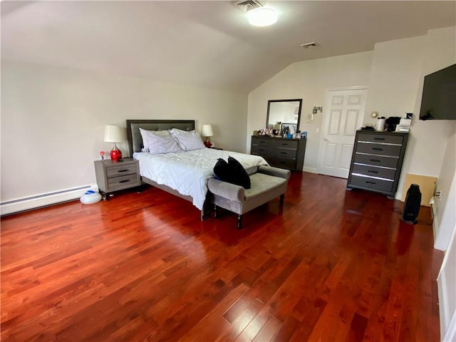 bedroom with lofted ceiling, wood finished floors, visible vents, and a baseboard heating unit