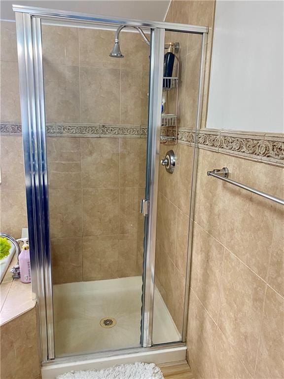 bathroom featuring a stall shower