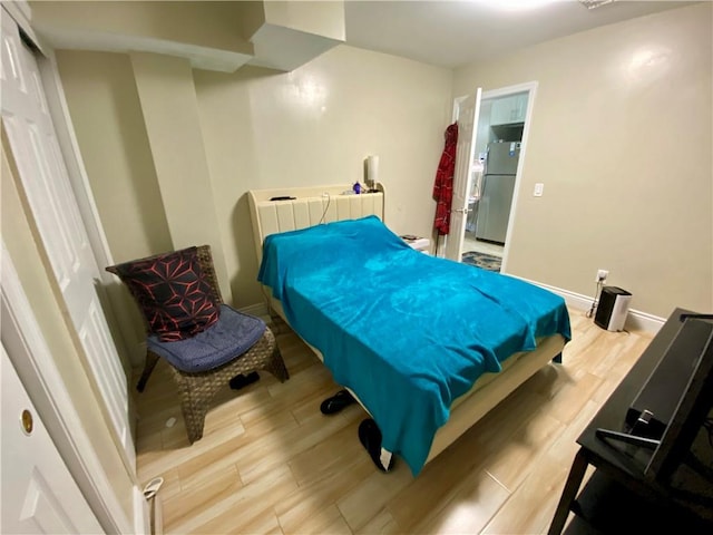 43 Lerer Ln, Staten Island, NY 10307 - bedroom featuring freestanding refrigerator and wood finished floors