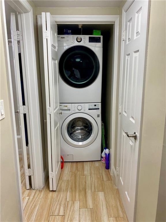 43 Lerer Ln, Staten Island, NY 10307 - laundry room with estacked washer and dryer and light wood-type flooring