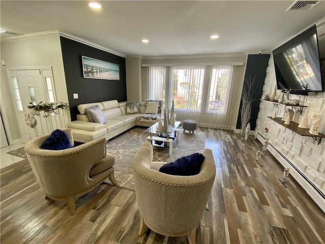 living area with a baseboard radiator, visible vents, wood finished floors, and ornamental molding