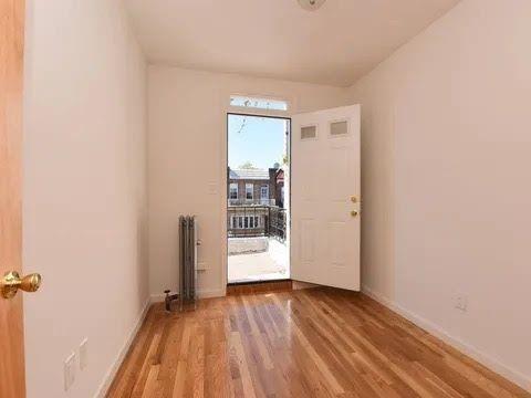 doorway to outside with hardwood / wood-style flooring