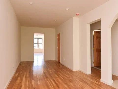 empty room with light wood-type flooring