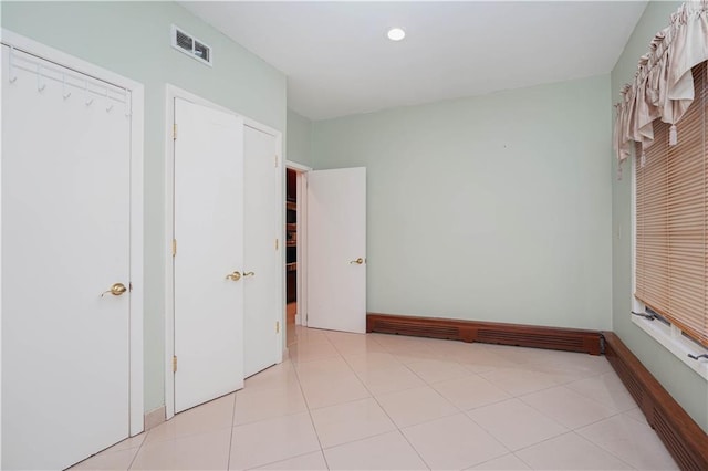 unfurnished bedroom featuring recessed lighting, visible vents, and baseboards
