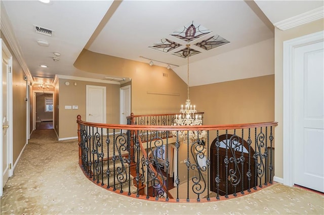 hallway with crown molding, an upstairs landing, baseboards, a notable chandelier, and visible vents