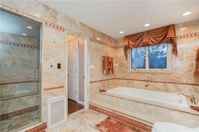 full bath featuring a stall shower, visible vents, recessed lighting, marble finish floor, and a garden tub